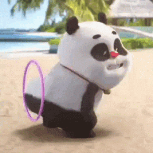 A Stuffed Panda Bear Is Playing With A Hula Hoop On The Beach . GIF