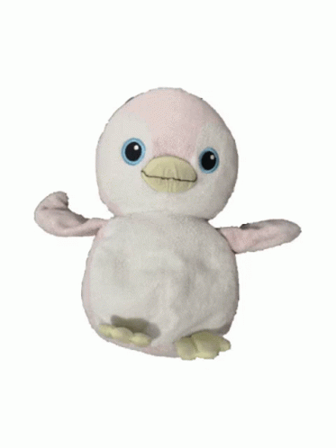 A Stuffed Penguin With A Yellow Beak Is Sitting On A White Background GIF