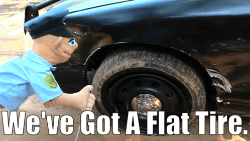 A Stuffed Police Officer Is Pumping Air Into A Flat Tire With The Caption We 'Ve Got A Flat Tire GIF