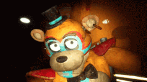 A Stuffed Teddy Bear Wearing A Top Hat And A Mask GIF