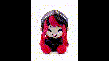 A Stuffed Toy Of A Girl With Red Hair And A Hat Is Sitting On A White Surface . GIF