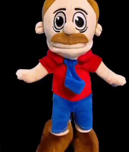 A Stuffed Toy With A Mustache And A Tie Is Dancing . GIF