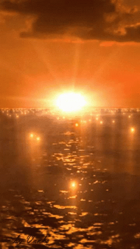 A Sunset Over A Body Of Water With A Watermark On The Bottom GIF