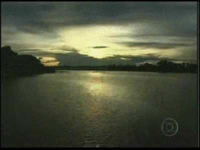 A Sunset Over A Body Of Water With The Letter O On The Bottom Left GIF