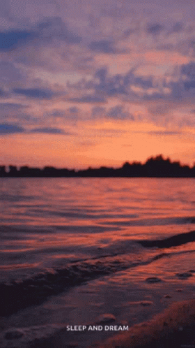 A Sunset Over A Body Of Water With The Words Sleep And Dream GIF