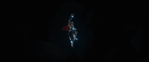 a superhero with a red cape and a lightning bolt