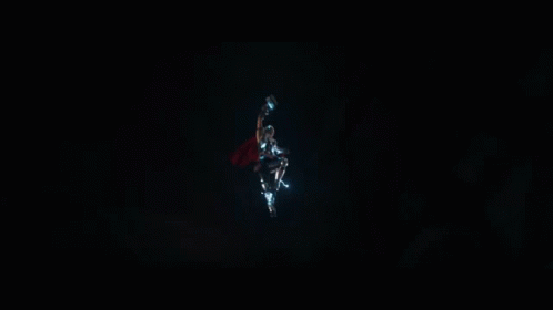a superhero with a red cape is being struck by lightning