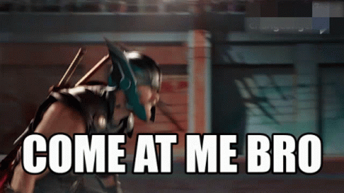 A Superhero With The Words Come At Me Bro Written On The Screen GIF