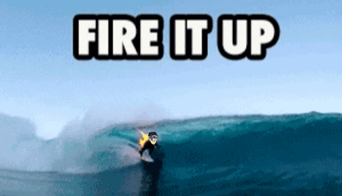 A Surfer Is Riding A Wave With The Words Fire It Up Above Him GIF