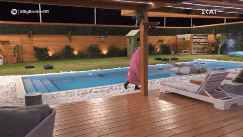 A Swimming Pool With A Sign That Says #Big Brother Gr GIF