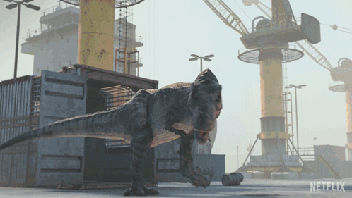 A T-Rex Is Standing In Front Of A Netflix Building GIF