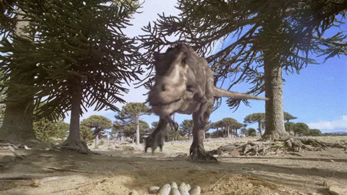 A T-Rex Is Walking Through A Forest With Trees Behind It GIF