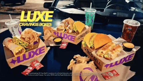 A Taco Bell Advertisement Shows A Luxe Cravings Box GIF