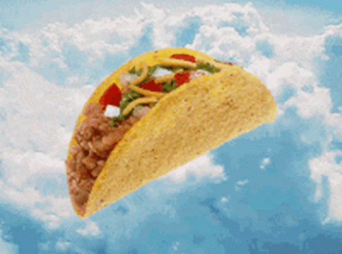 A Taco Is Flying Through The Air In The Sky GIF
