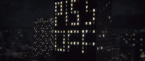 A Tall Building With The Word Lg On It GIF