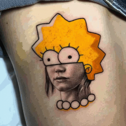 A Tattoo Of A Woman 'S Face With A Yellow Hat GIF