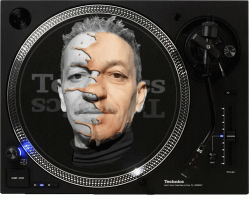 A Technics Turntable With A Face On It GIF