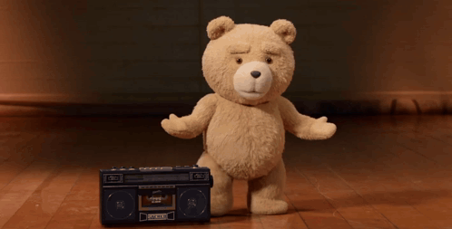 A Teddy Bear Is Dancing Next To A Boombox That Says ' Pioneer ' On The Front GIF