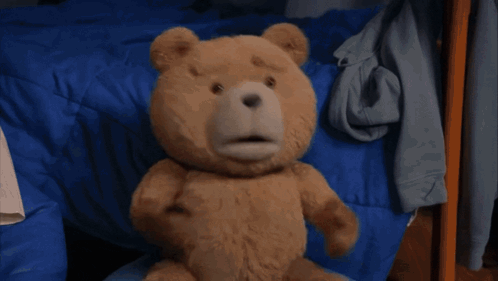 A Teddy Bear Is Dancing On A Rug In A Room . GIF