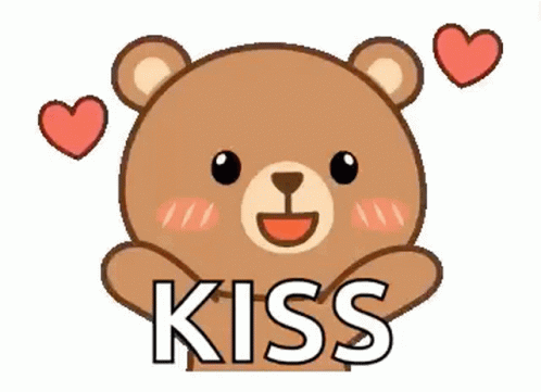A Teddy Bear Is Holding A Heart And Saying Kiss . GIF