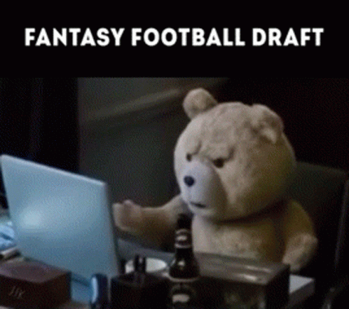 A Teddy Bear Is Sitting At A Desk With A Laptop And The Words Fantasy Football Draft On The Bottom GIF