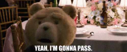 A Teddy Bear Says Yeah I 'M Gonna Pass While Sitting At A Table GIF