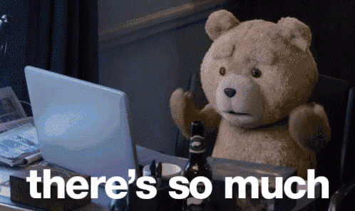 A Teddy Bear Sitting In Front Of A Laptop With The Words " There 'S So Much " Written Below It GIF