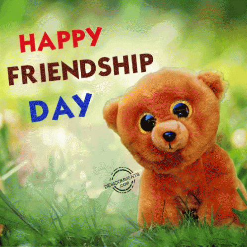 A Teddy Bear Sitting In The Grass With The Words Happy Friendship Day GIF