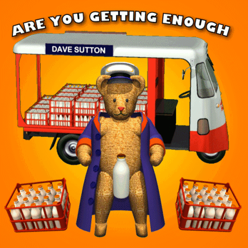 A Teddy Bear Standing In Front Of A Milk Truck That Says Dave Sutton GIF
