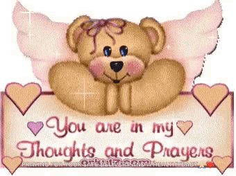 A Teddy Bear With Wings Is Holding A Sign That Says `` You Are In My Thoughts And Prayers '' . GIF