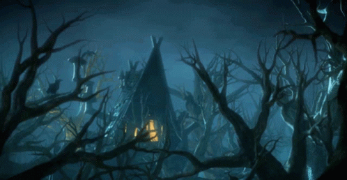 A Teepee In The Middle Of A Dark Forest With Trees Without Leaves GIF