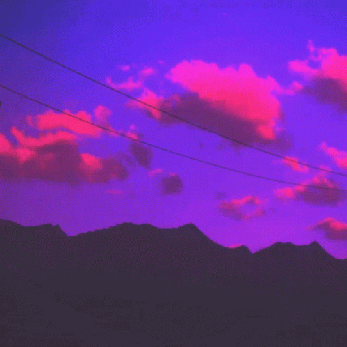 A Telephone Pole With A Purple Sky In The Background GIF