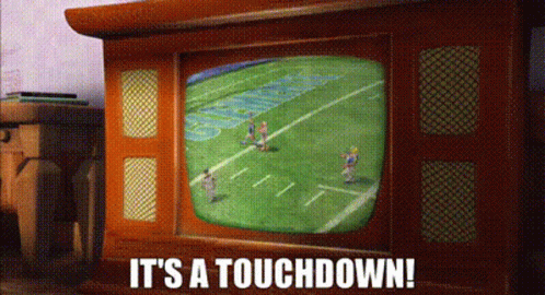 a television screen shows a football game and the words " it 's a touchdown " below it