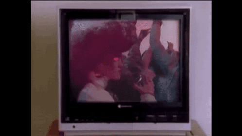 A Television With A Picture Of A Man And Woman On It GIF