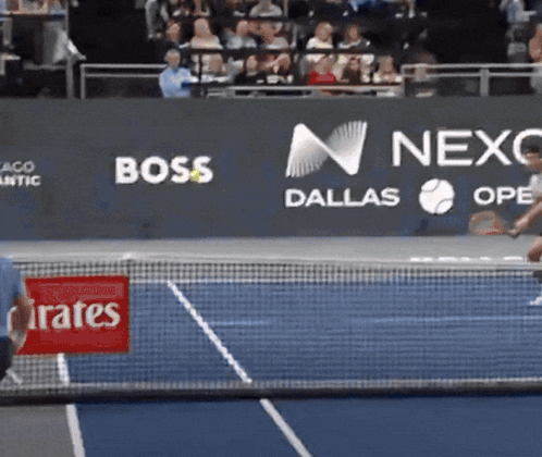 A Tennis Court With A Banner That Says Boss Dallas On It GIF