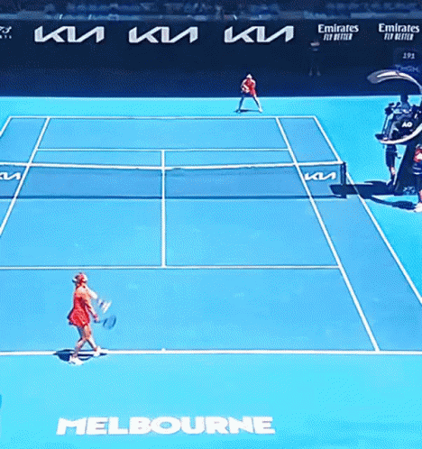 A Tennis Match Is Being Played On A Court Sponsored By Emirates Fly Better GIF