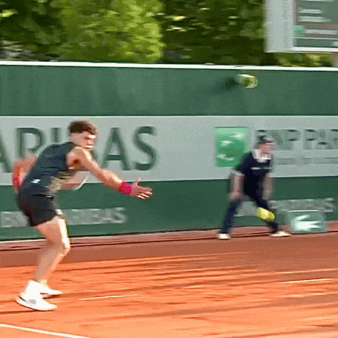 A Tennis Player Is About To Serve The Ball In Front Of A Bnp Paribas Advertisement GIF
