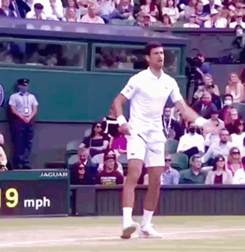 A Tennis Player On A Court With A Sign That Says 90 Mph In The Background GIF