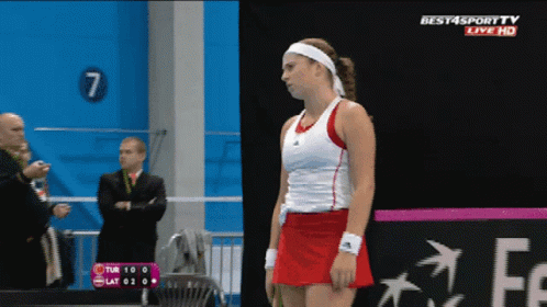 A Tennis Player Stands In Front Of A Sign That Says Best4sport Tv Live Hd GIF