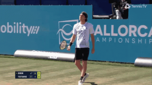 A Tennis Player Stands In Front Of A Sign That Says Mobility GIF