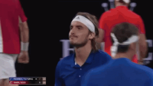 A Tennis Player Wearing A Headband With The Word Adidas On It Looks At The Camera GIF