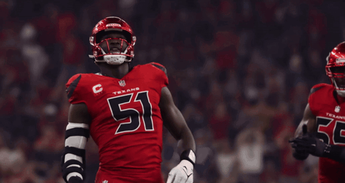 A Texans Football Player Wearing Number 51 Stands Next To Another Player Wearing Number 55 GIF