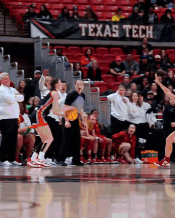 A Texas Tech Banner Hangs Over A Basketball Court GIF