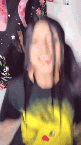 A Tiktok Video Of A Girl With Long Hair GIF