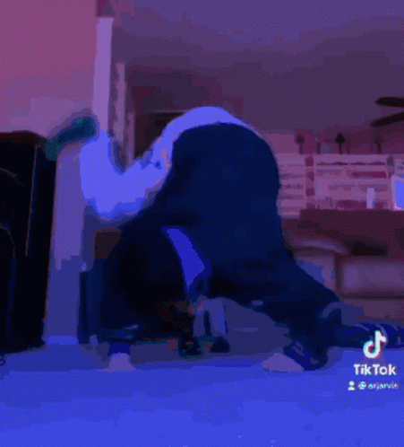 A Tiktok Video Of A Person Laying On Their Back With A Green Sock On GIF