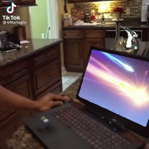 A Tiktok Video Of A Person Using A Laptop With A Shooting Star On The Screen GIF
