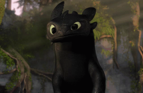 A Toothless From How To Train Your Dragon Is Smiling GIF