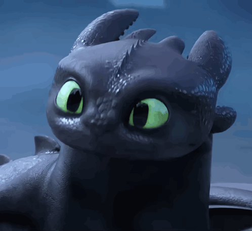 A Toothless From How To Train Your Dragon With Green Eyes GIF