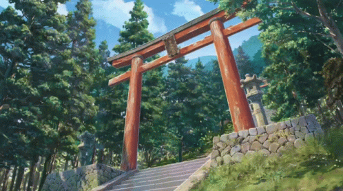 A Torii Gate In A Forest With Stairs Leading Up To It GIF