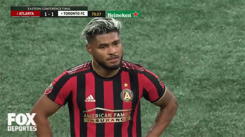 a toronto fc soccer player stands on the field during the fox deportes broadcast